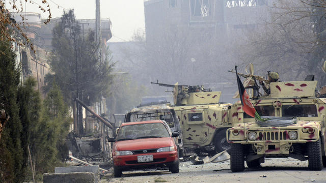 Smoke rises at the site of a blast near the office of the Save the Children aid agency in Jalalabad, Afghanistan 