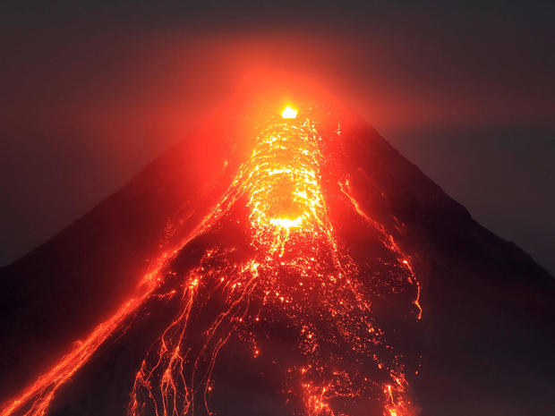 Lava flows from the crater of Mount Mayon volcano during a new eruption in Legazpi city 