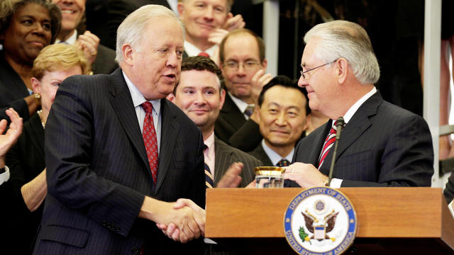 FILE PHOTO:    U.S. Secretary of State Rex Tillerson shakes hands with acting U.S. Secretary of State Tom Shannon while delivering remarks to Department of State employees upon arrival at the Department of State in Washington 