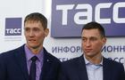 Russian cross-country skiers Legkov and Kryukov attend a news conference in Moscow 