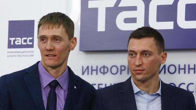 Russian cross-country skiers Legkov and Kryukov attend a news conference in Moscow 