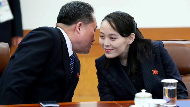 Ri Son-kwon, chairman of the Committee for the Peaceful Reunification of the Fatherland whispers to Kim Yo Jong, the sister of North Korea's leader Kim Jong Un before their meeting at the Presidential Blue House in Seoul 