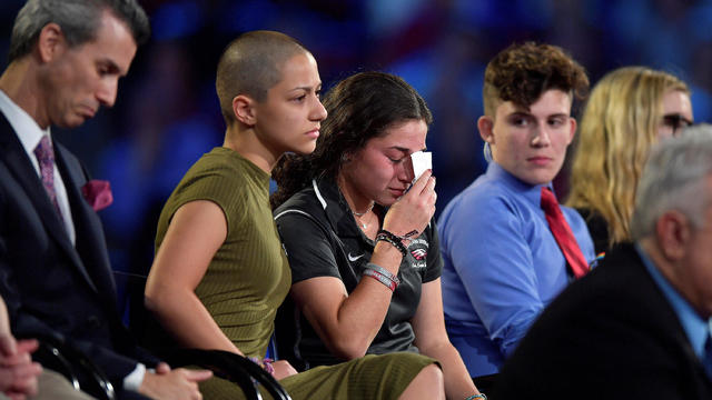 Marjory Stoneman Douglas High School student Emma Gonzalez comforts a classmate during a CNN town hall meeting, at the BB&T Center, in Sunrise 