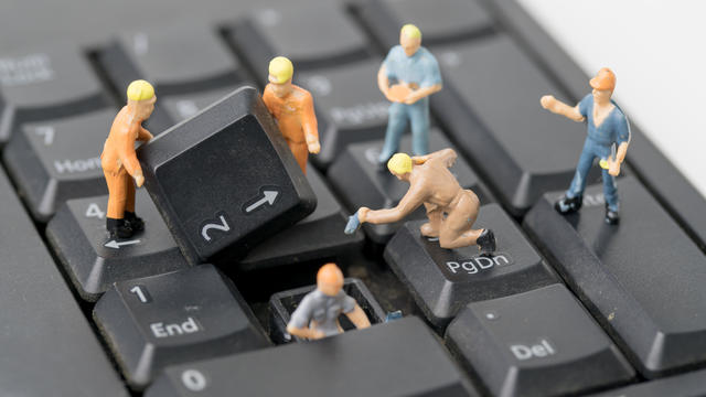 miniature people Work on Computer Keyboard 