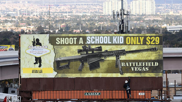 Subversive Art Group Vandalizes Billboard Ad For Battlefield Vegas Machine Gun Range 