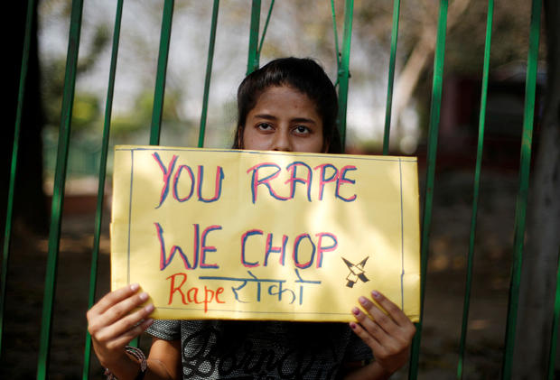 A girl holds a placard as she takes part in a movement against rapes on the occasion of International Women’s Day in New Delhi 