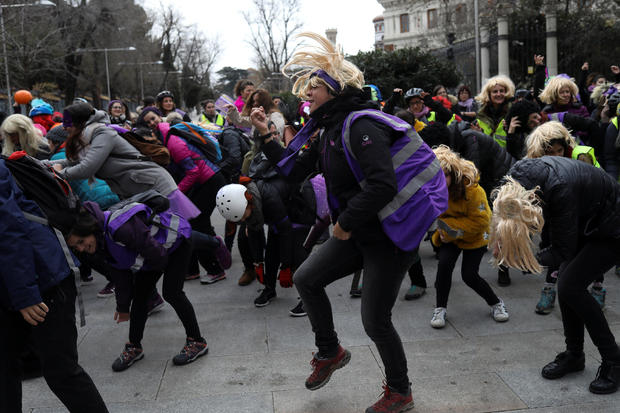Women dance during a protest as as part of a nationwide feminist strike on International Women's Day in Madrid 