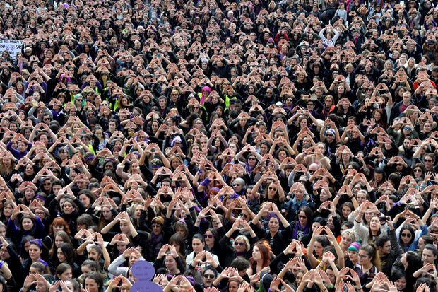 Protesters form triangles with their hands during a demonstration for women's rights in Bilbao 