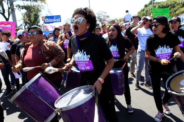 Activists take part in a march to mark International Women's Day in Managua 