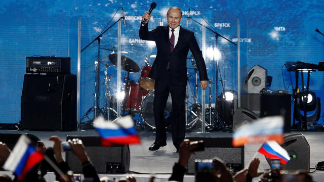 Russian president Vladimir Putin addresses the audience during a rally marking the fourth anniversary of Russia's annexation of Ukraine's Crimea region in the Black Sea port of Sevastopol 