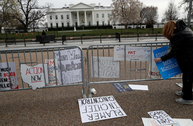 People leave their leftover signs outside of the White House after students and gun control advocates held the "March for Our Lives" event demanding gun control after recent school shootings at a rally in Washington 
