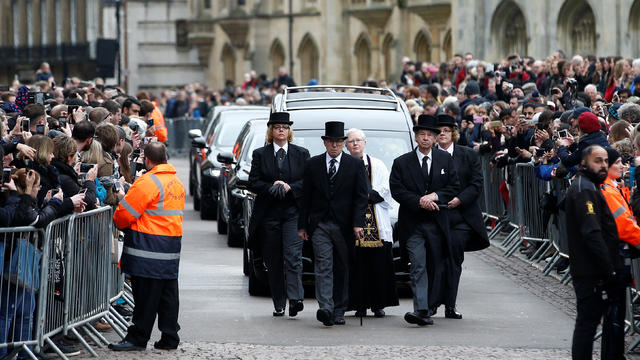 The funeral cortege arrives at Great St Marys Church, where the funeral of theoretical physicist Prof Stephen Hawking is being held, in Cambridge 