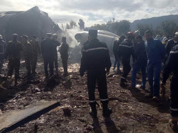 An Algerian military plane is seen after crashing near an airport outside the capital, Algiers, on April 11, 2018, in this still image taken from a video.