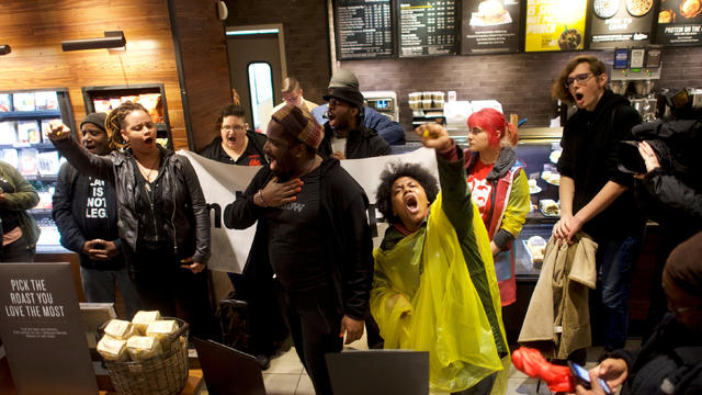 Protestors demonstrate inside a Center City Starbucks, where two black men were arrested, in Philadelphia 