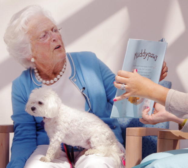 Barbara Bush reads a book titled Muddypaws to children at the Barbara Bush Children's Hospital at Ma 