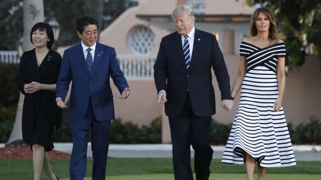 U.S. President Trump and first lady Melania Trump walk with Japan's Prime Minister Abe and Abe's wife Akie in Palm Beach 