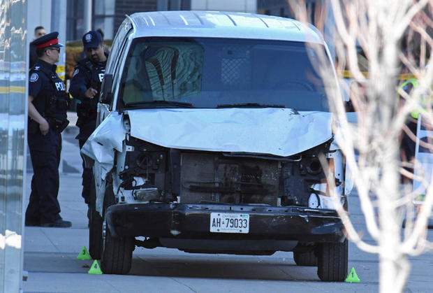 A damaged van seized by police is seen after multiple people were struck at a major intersection northern Toronto 