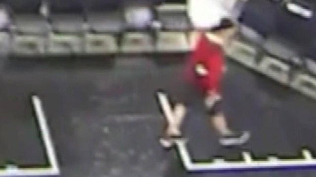 A man is seen walking toward a jacket belonging to a Golden State Warriors security official at AT&T Center in San Antonio on April 19, 2018. 