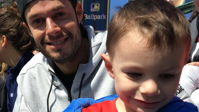 Joe Kelly, suspended Boston Red Sox pitcher, watches from bleachers