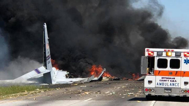 Crews work the scene after a plane crashed on a road in Savannah, Georgia, on May 2, 2018. 