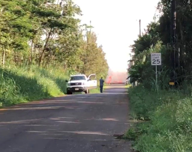 Lava erupting along a road is seen in Leilani Estates, Puna, Hawaii 