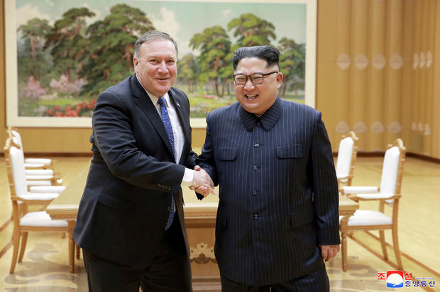 North Korean leader Kim Jong Un shakes hands with U.S. Secretary of State Mike Pompeo 
