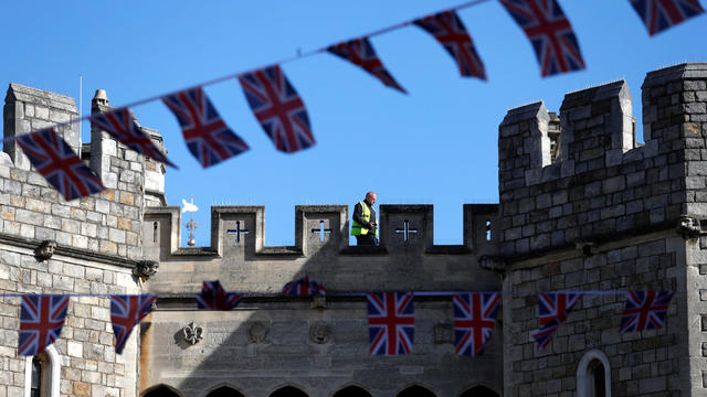 Security personnel patrol the roof of Windsor Castle before the upcoming wedding of Britain's Prince Harry and Meghan Markle in Windsor 