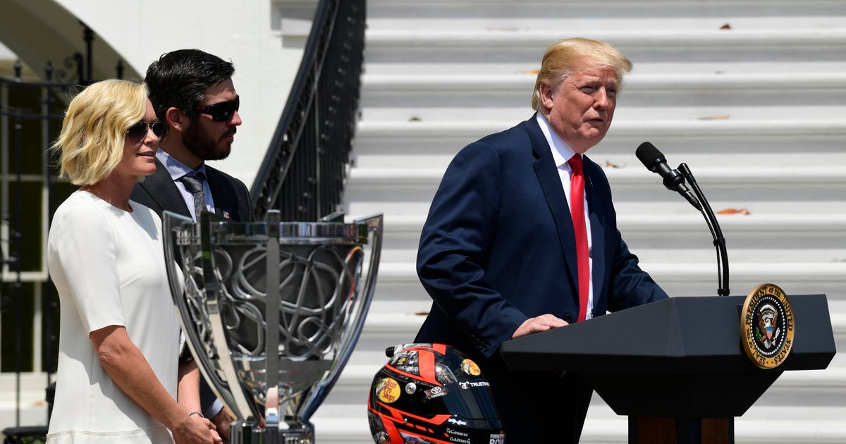 Trump praises NASCAR drivers for standing for national anthem - CBS News