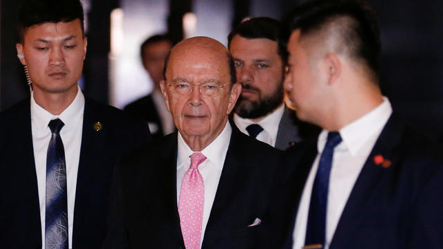 U.S. Commerce Secretary Wilbur Ross leaves a hotel ahead of trade talks with Chinese officials in Beijing 