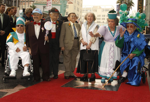 Munchkins from the 1939 movie classic "The Wizard of Oz" pose with their new star on the Hollywood Walk of Fame during their induction ceremony Nov. 20, 2007, in front of Grauman's Chinese Theatre in Hollywood, California. From left to right are Clarence 