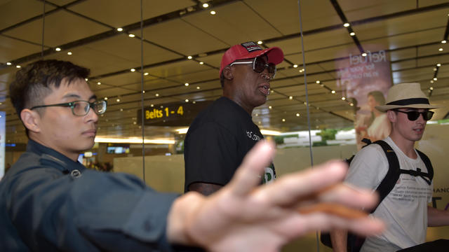 Retired American professional basketball player Dennis Rodman arrives at Changi International airport ahead of the U.S.-North Korea summit in Singapore on June 11, 2018. 