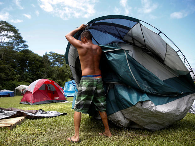 David Pio, who was forced by volcanic activity to leave his home in Leilani Estates, moves his tent in an evacuation center in Keaau during ongoing eruptions of the Kilauea Volcano in Hawaii 