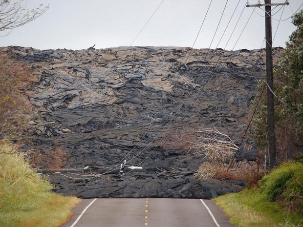 Lava covers a road on the outskirts of Pahoa 