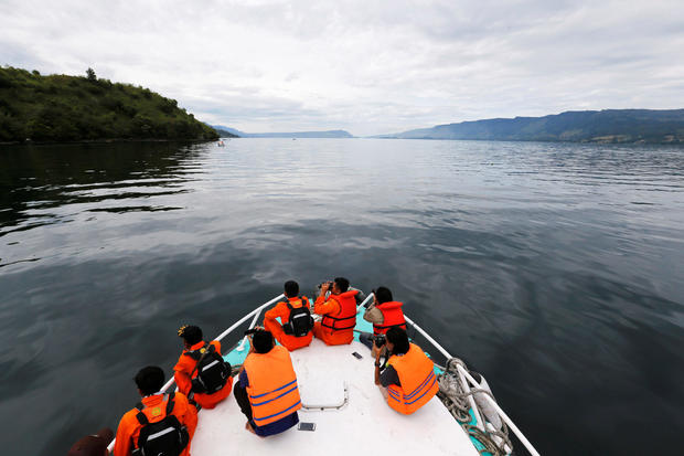 Search and rescue personnel look for missing passengers from Monday's ferry accident at Lake Toba in Simalungun 