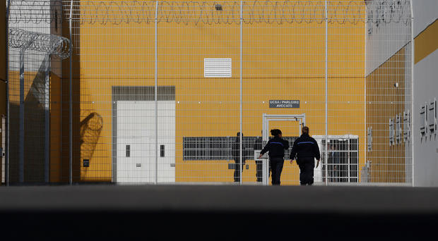 FILE PHOTO: Prison guards enter the Reau penitentiary 