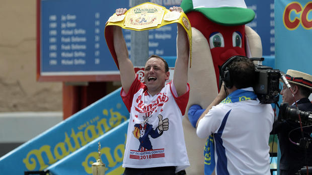 Joey Chestnut wins the annual Nathan's Hot Dog Eating Contest, setting a new world record by eating 74 hot dogs  in Brooklyn, New York City 
