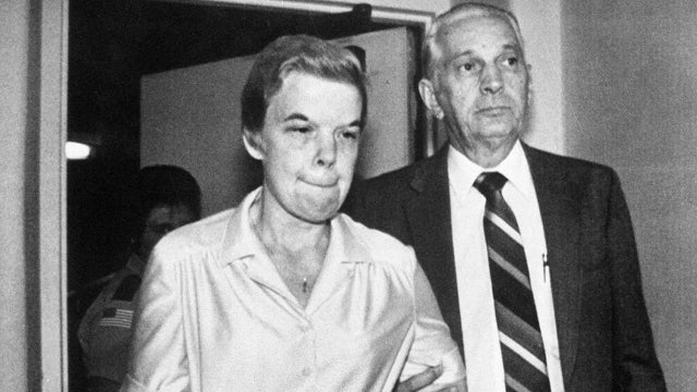 Marybeth Tinning is led to Schenectady County Court by Sheriff Bernard Waldron in Schenectady, N.Y., on Oct. 1, 1987, after Tinning received a 20-years-to-life sentence for smothering her infant daughter with a pillow. 