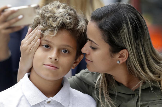 Sirley Silveira Paixao, an immigrant from Brazil seeking asylum in the U.S., looks at her 10-year-old son Diego Magalhaes after Diego was released from immigration detention July 5, 2018, in Chicago. 