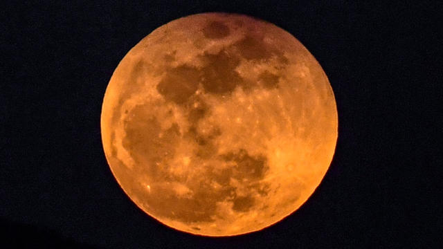 The moon rises behind a mountain during a lunar eclipse, referred to as the "super blue blood moon," near the Syria-Turkey border at the Hassa district in Hatay, Turkey, on Jan. 31, 2018. 