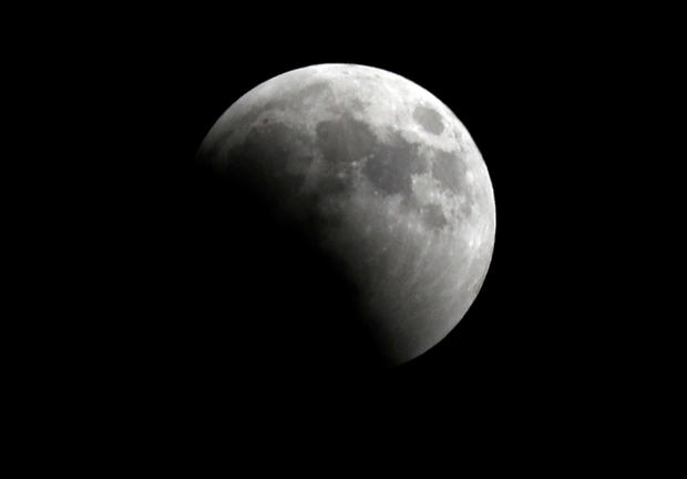 A "Super Blue Blood Moon" rises during a lunar eclipse over Cairo 