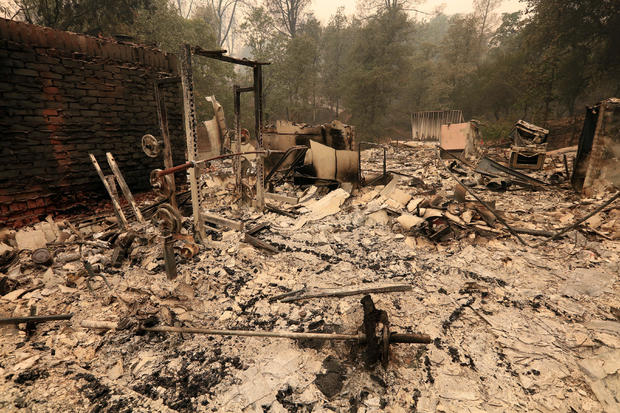 The debris of a burned home is seen after the Carr Fire west of Redding 