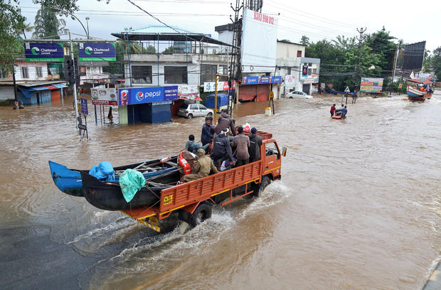 Supply truck transports boats to flooded areas in Aluva 