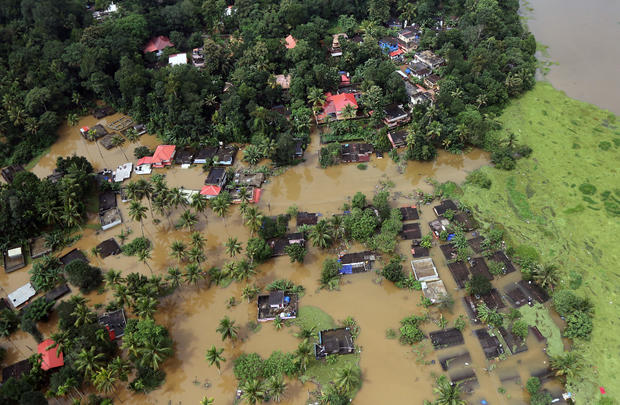 An aerial view shows partially submerged houses at a flooded area in the southern state of Kerala 