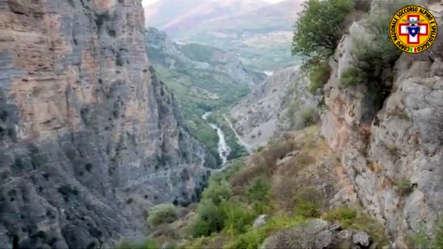 A general view shows the area after several people were killed in a mountain gorge flooding, in the municipality of Civita 
