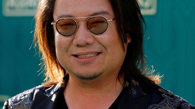 FILE PHOTO: Author Kwan poses at the premiere for "Crazy Rich Asians" in Los Angeles 