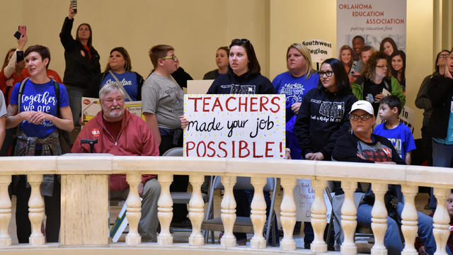 Teachers rally inside of the state Capitol rotunda on the second day of a teacher walkout to demand higher pay and more funding for education in Oklahoma City 