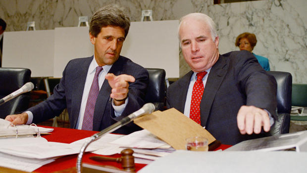 Sen. John Kerry, D-Mass, chairman of the Senate POW/MIA Committee, left, gestures while talking to Sen. John, McCain, R-Ariz, a former POW, prior to a hearing of the committee Wednesday, June 24, 1992 at Capitol Hill. Kerry said Wednesday that as many as 133 prisoners of war may have been left behind when the Vietnam War ended, and the Pentagon deliberately misled families about the fate of some servicemen lost during the fighting. (AP Photo/John Duricka) 