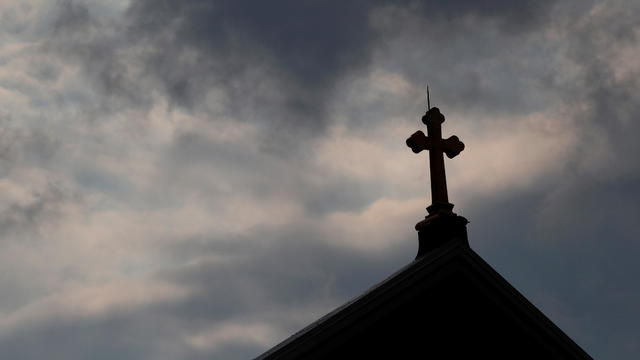 FILE PHOTO: Storm clouds pass over a Roman Catholic church in Pittsburgh 