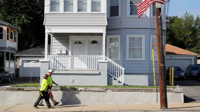 A Columbia Gas of Massachusetts crew works in a neighborhood evacuated following a series of gas explosions in Lawrence 