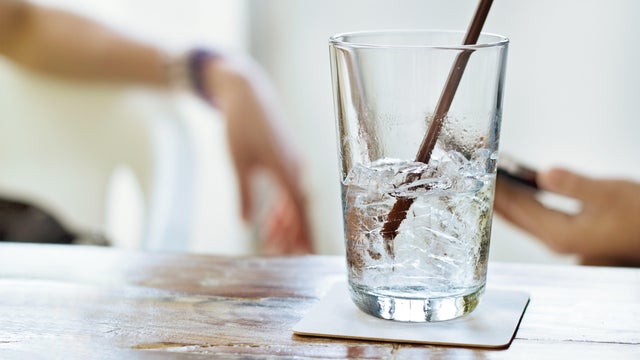 glass of water and ice on a table in restaurant 
